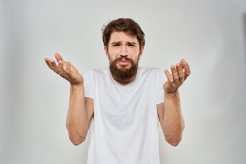 Bearded man gesturing with hand white cropped t-shirt studio lifestyle