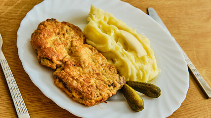 Inside out beef schnitzel with potato pyre on plate