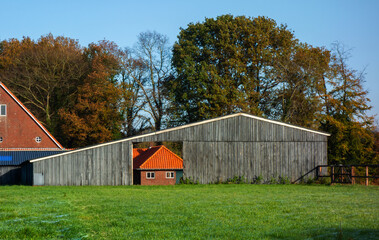 Detail of a house seen through an opening in a shed
