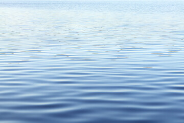 River water surface with waves as nature background. Ripple water texture.