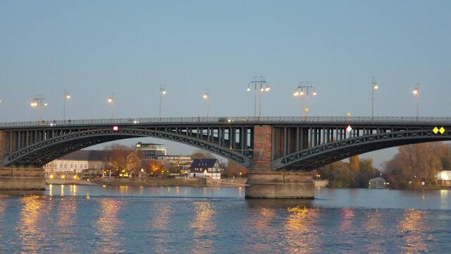 Tracking pan shot of the Theodor Heuss bridge over the Rhine in Mainz, Germany in the evening while blue hour.