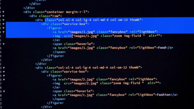 Developer is browsing and marking html code on the computer screen. Code Scrolling. Computer script concept.Scene J