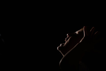 Child screams with his head up.