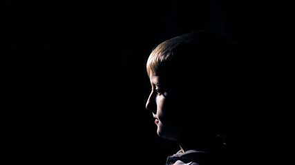 Backlit portrait of a child.