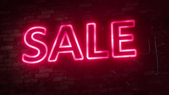 red neon sign sale on a brick wall