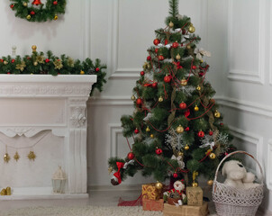 New Year's atmosphere in the studio. Decorations with a Christmas tree and a fireplace.
