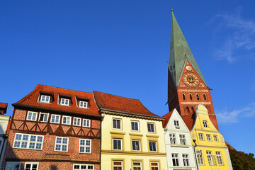 Typical German houses and St. John's Church on the background. Luneburg, Germany, Europe.