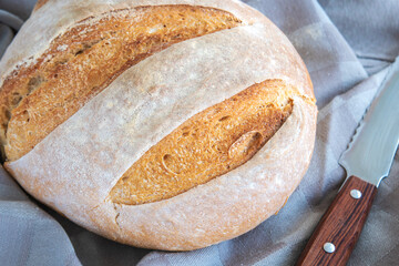 Homemade round bread of wheat flour and spelt