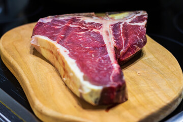 Raw prime T-Bone marbled beef steak ready for grill