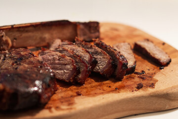 Grilled prime T-Bone marbled beef steak on a plate.