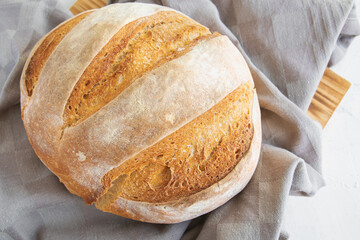 Homemade round bread of wheat flour and spelt