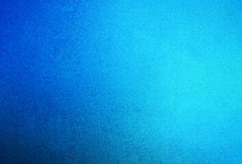 Blue frozen window covered with frost.