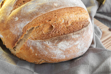 Homemade round bread of wheat flour and spelt