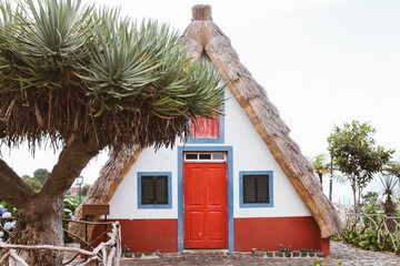 Fototapeta na wymiar Traditional blue and red houses in a village Santana, Madeira, Portugal 