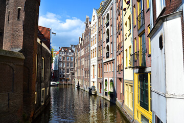 Fototapeta na wymiar Traditional dutch architecture, facades of houses along the canal. Amsterdam, The Netherlands.