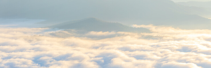 Panorama photo of Sunrise time with sea of fog and clouds with mountain hill at Sri Nan National Park Doi Samer Dao Nan Province Thailand, Asia.