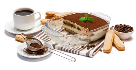 Traditional Italian Tiramisu dessert in glass baking dish isolatet on white background