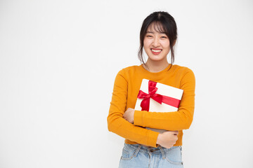 Happy beautiful asian woman smile and holding gift box isolated on white background. Teenage girls in love, Receiving gifts from lovers. New Year, Christmas and Valentines Day concept