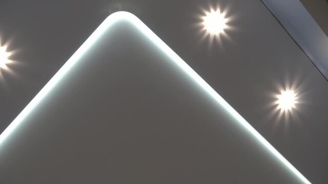 suspended ceilings and plasterboard structures in the decoration of an apartment or house. Dolly video. Led lighting.