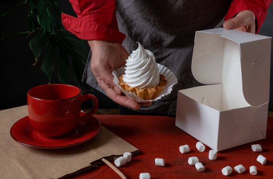 cup cake tart hand confectioner box white paper box red table