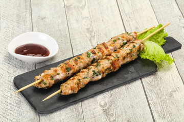 Minced pork skewer kebab with sauce