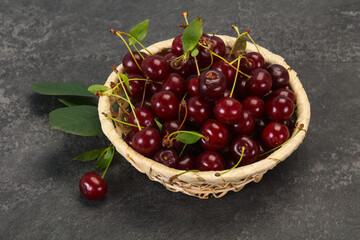 Fototapeta na wymiar Sweet ripe cherry with leaves