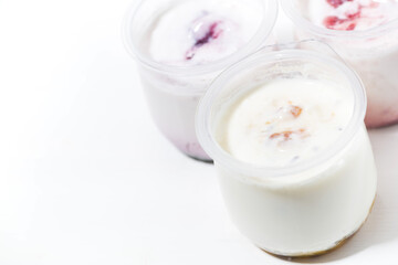 Fototapeta na wymiar assortment of yogurts with fruit additives, top view