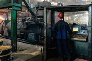 Obraz na płótnie Canvas Iron pipe centrifugal pipe casting machine at the foundry