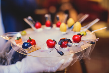 Beautifully decorated catering banquet table with variety of vegetables and different vegan vegetarian snacks on corporate christmas birthday party event or wedding celebration