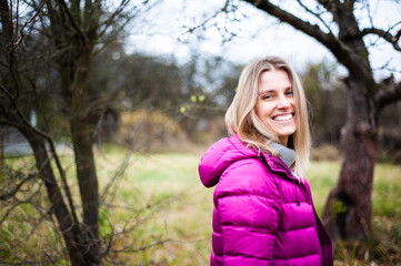 Portrait of beautiful blonde smiling woman in autumn. Welcome warm autumn. 