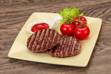 Grilled burger cutlet with sauce