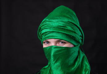 Beautifu musliml woman dressed in green headscarf