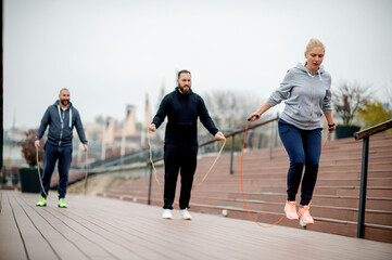 Group of friends doing fitness exercise outdoor
