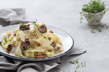 Homemade Italian fettuccine pasta with mushrooms and cream sauce