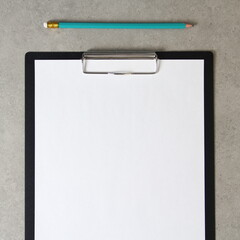 Template of white paper with simple pencil on light grey concrete background in a black tablet with a clip. Concept of new idea, business plan and strategy,  empty space for text