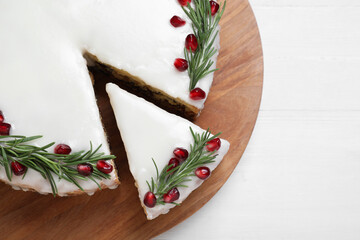 Traditional Christmas cake on white wooden table, top view