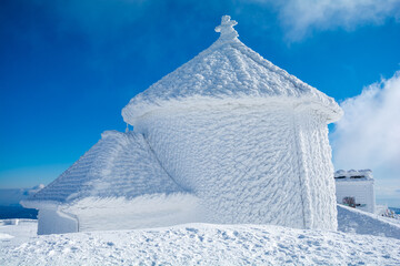 amazing winter landscape with hoar frost on building