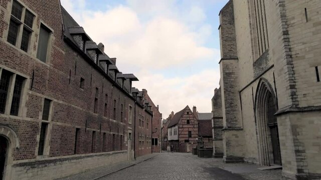 Tracking shot at the Sint-Jan-de-Doperkerk in the beguinage (Groot Begijnhof) of Leuven, Belgium