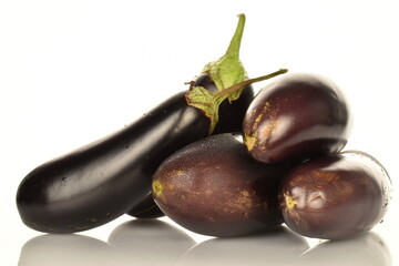 Several ripe dark blue eggplant, close-up, isolated on white.