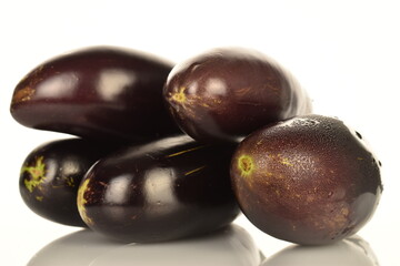 Several ripe dark blue eggplant, close-up, isolated on white.