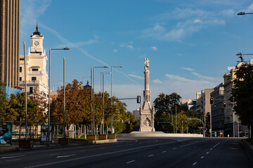 columbus square in madrid, on a sunday morning with no traffic or people passing through the street