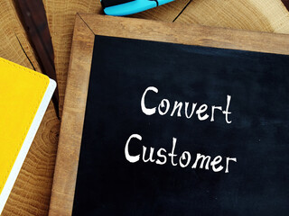 Business concept about Convert Customer with sign on the sheet.