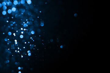 Abstract bokeh on dark blue background. Holiday concept