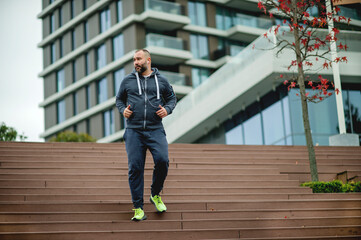 Young man jogging on stairs