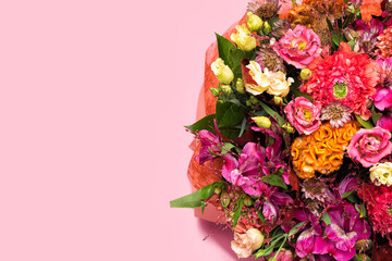 Colorful autumn bouquet of flowers on pink background. Copy space for your text