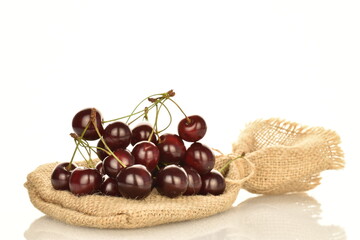 Several ripe berries of cherries, close-up, isolated on a white background.