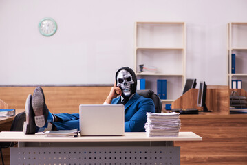 Devil businessman working in the office