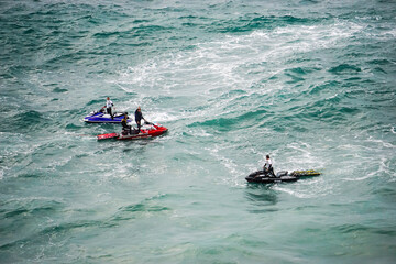 Surfers on Nazare Beach in Portugal