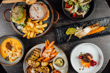 A top view of a restaurant table with delicious gourmet foods.