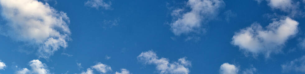 fine white clouds in blue sky panorama